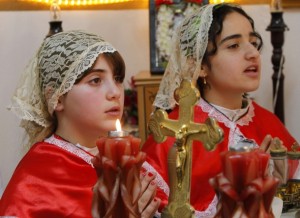 Iraqi Christians attend an Easter mass at Chaldean Catholic church. Thousands of Iraqi Christians fled to neighboring Jordan following a spate of bombings that targeted churches in Iraqi cities in the past few years. REUTERS/Ali Jarekji (JORDAN - Tags: RELIGION SOCIETY)